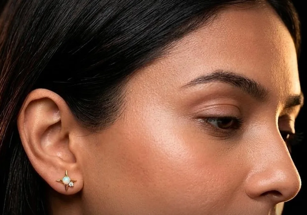 Model wearing the Star Opal stud in gold